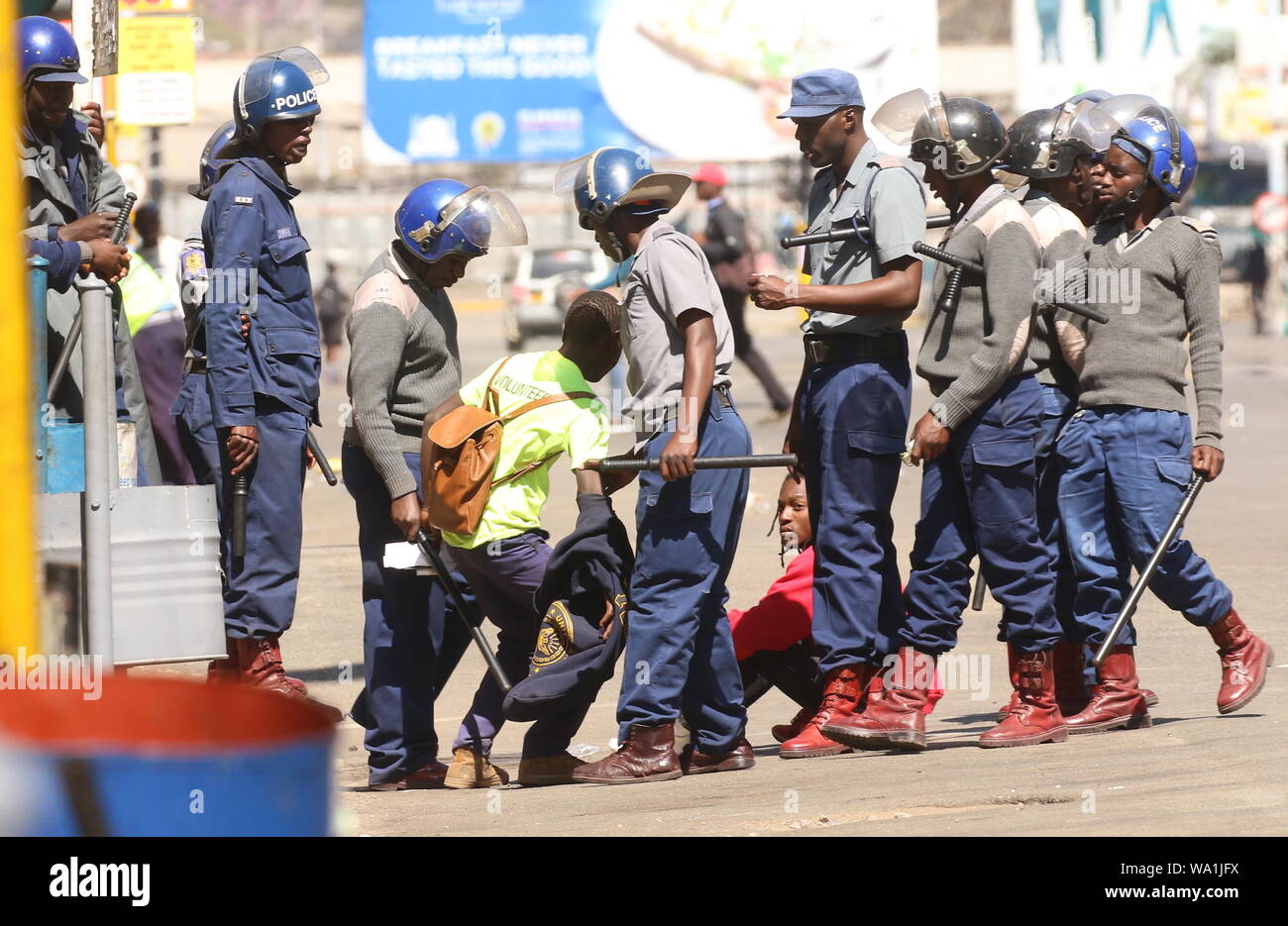 Harare, Zimbabwe. 16th Aug, 2019. Police officers arrest protesters in Harare, Zimbabwe, on Aug. 16, 2019. Shops, banks and retail outlets in Zimbabwe's capital Harare were closed on Friday after the High Court banned a planned demonstration by the opposition MDC Alliance. Heavily armed police officers patrolled the central business district while some were stationed at strategic areas in the city center, including at Africa Unity Square where protesters were due to congregate. Credit: Shaun Jusa/Xinhua Credit: Xinhua/Alamy Live News Stock Photo