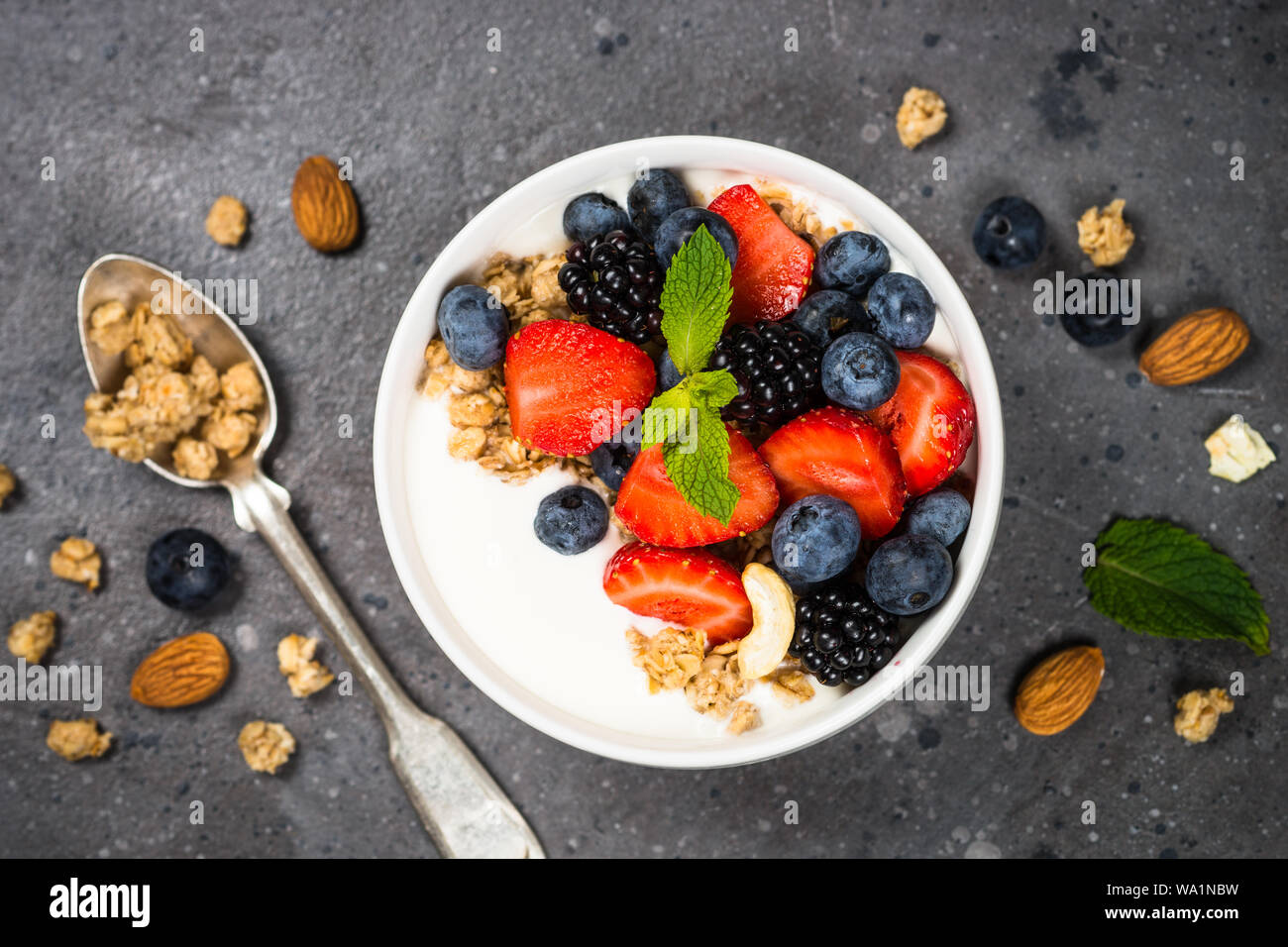 Greek yogurt granola with fresh berries Stock Photo - Alamy
