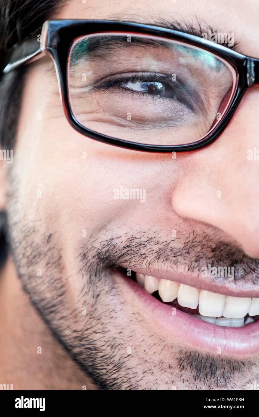 Man with glasses smiling, close-up. Stock Photo