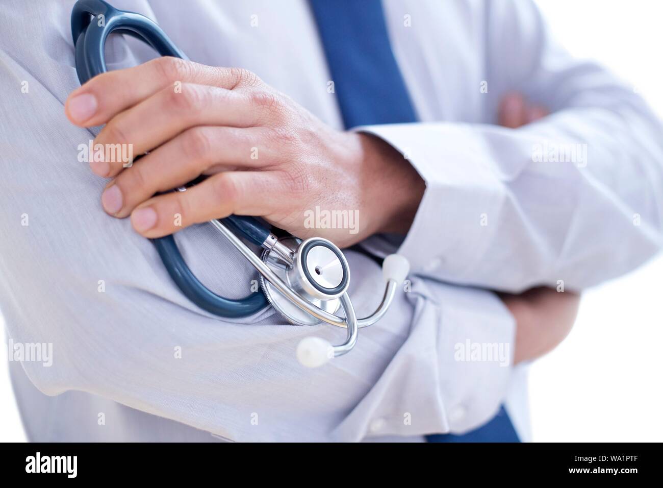Doctor holding stethoscope, close-up. Stock Photo