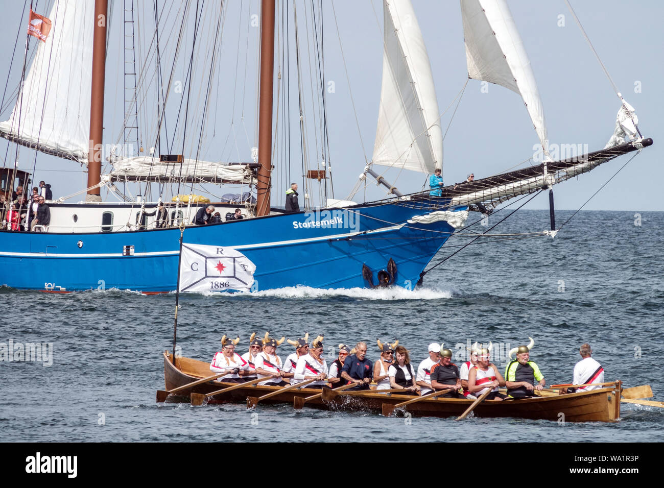 baltic-sea-sailing-ship-stortemelk-and-members-of-rowing-club-ruder