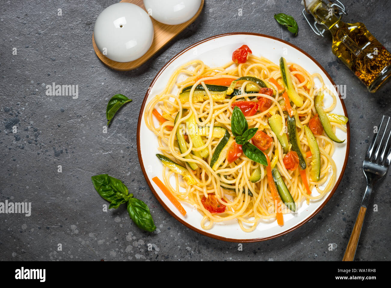 Pasta spaghetti with zucchini, carrot and tomato Stock Photo Alamy