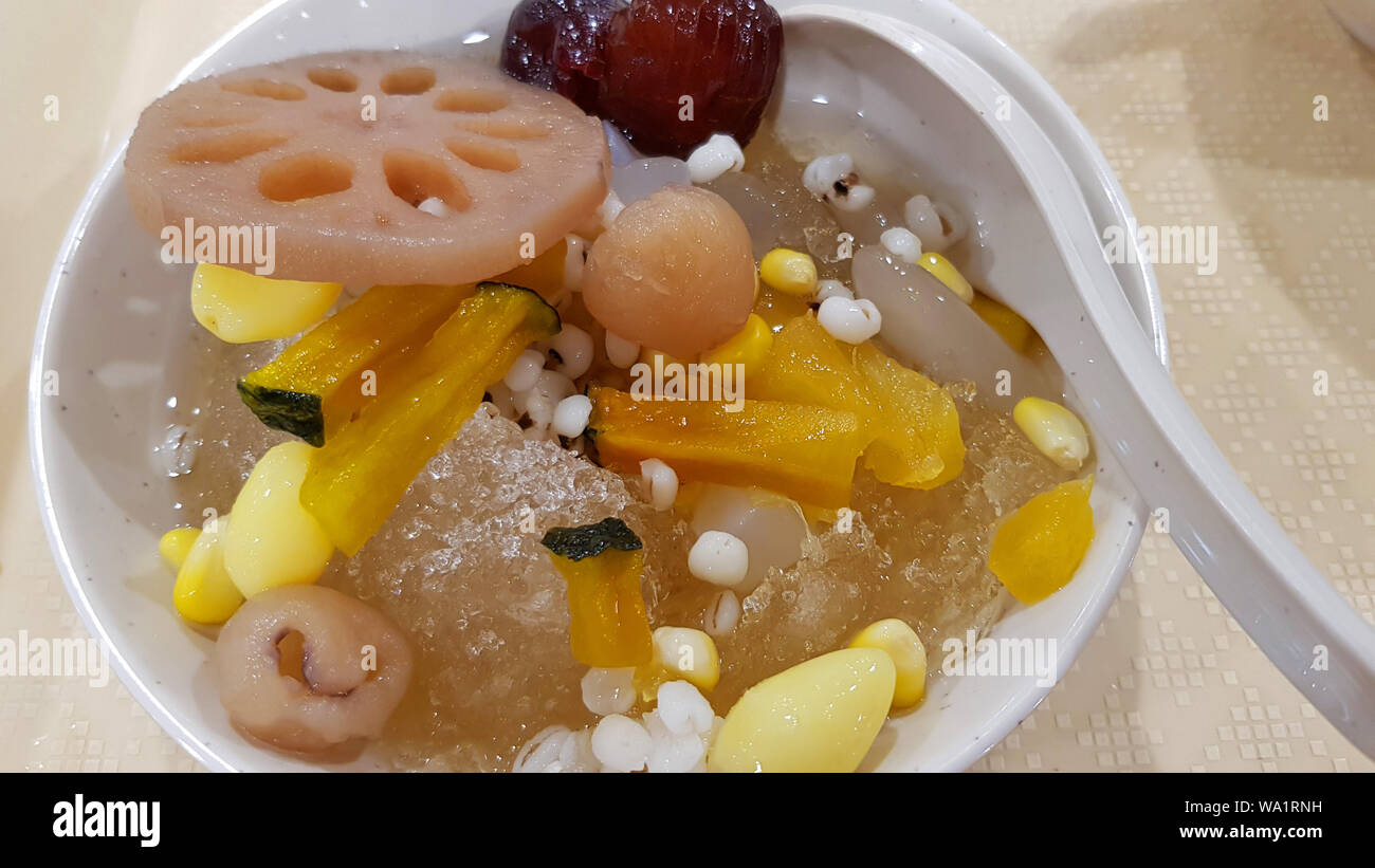Sweet dessert, cold water taothueng longan, kind of Chinese dessert menu, Chinese syrup dessert had many kind of fruits even the syrup was came from l Stock Photo