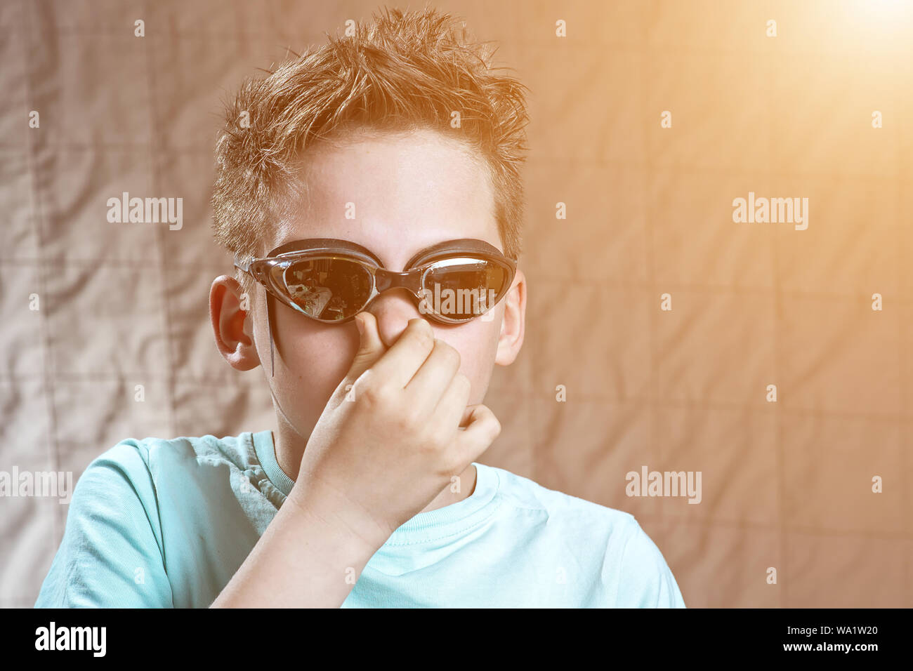 portrait of a boy in swimming goggles in different poses Stock Photo