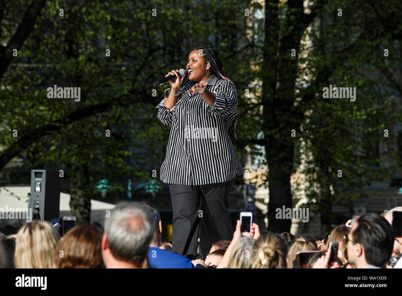 Rap artist B.W.A (Betty Aho) on catwalk at Marimekko annual fashion show in Esplanade Park in Helsinki, Finland Stock Photo