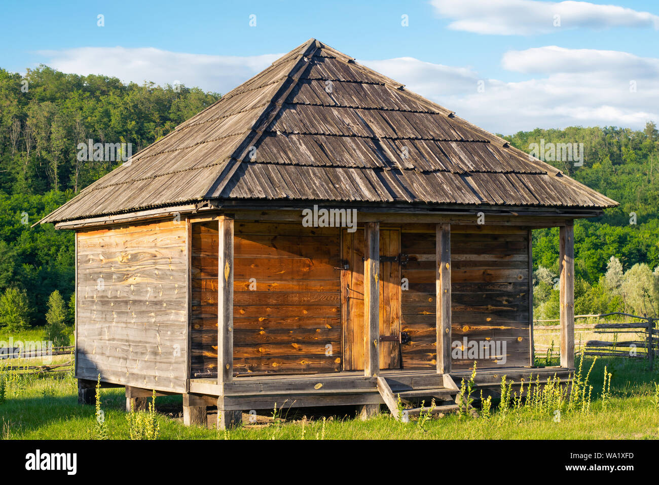 Wooden traditional house. The houses of peasants of the 16th century