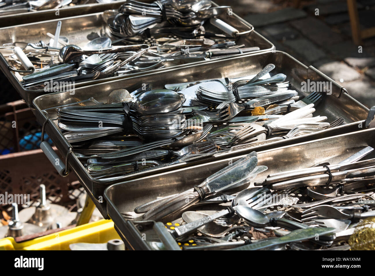 Bins of antique silverware at the Arkonaplatz flea market, Berlin, Germany Stock Photo Alamy