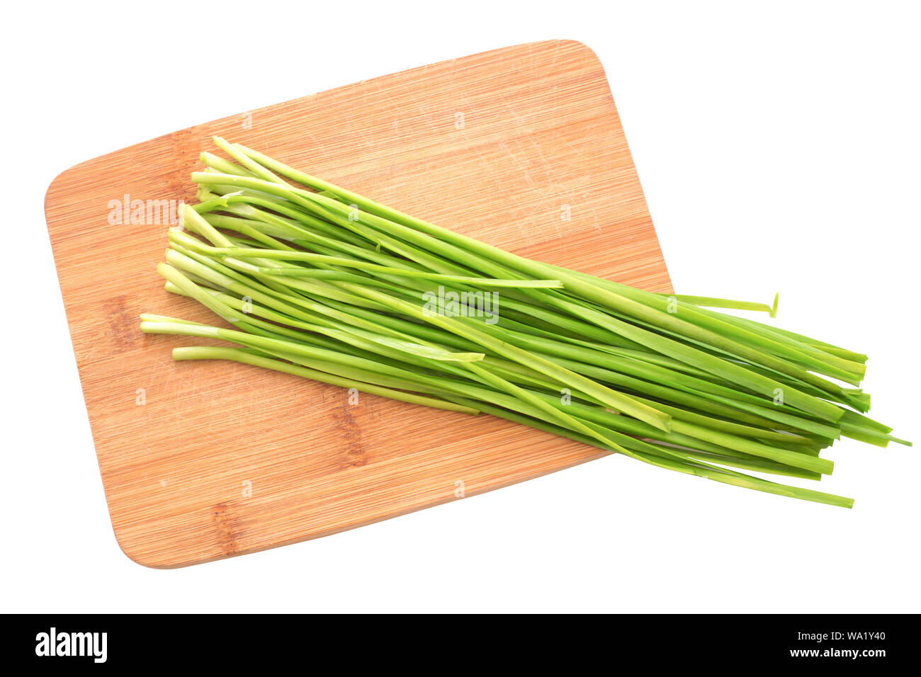 Bunch of chives on white background Stock Photo - Alamy