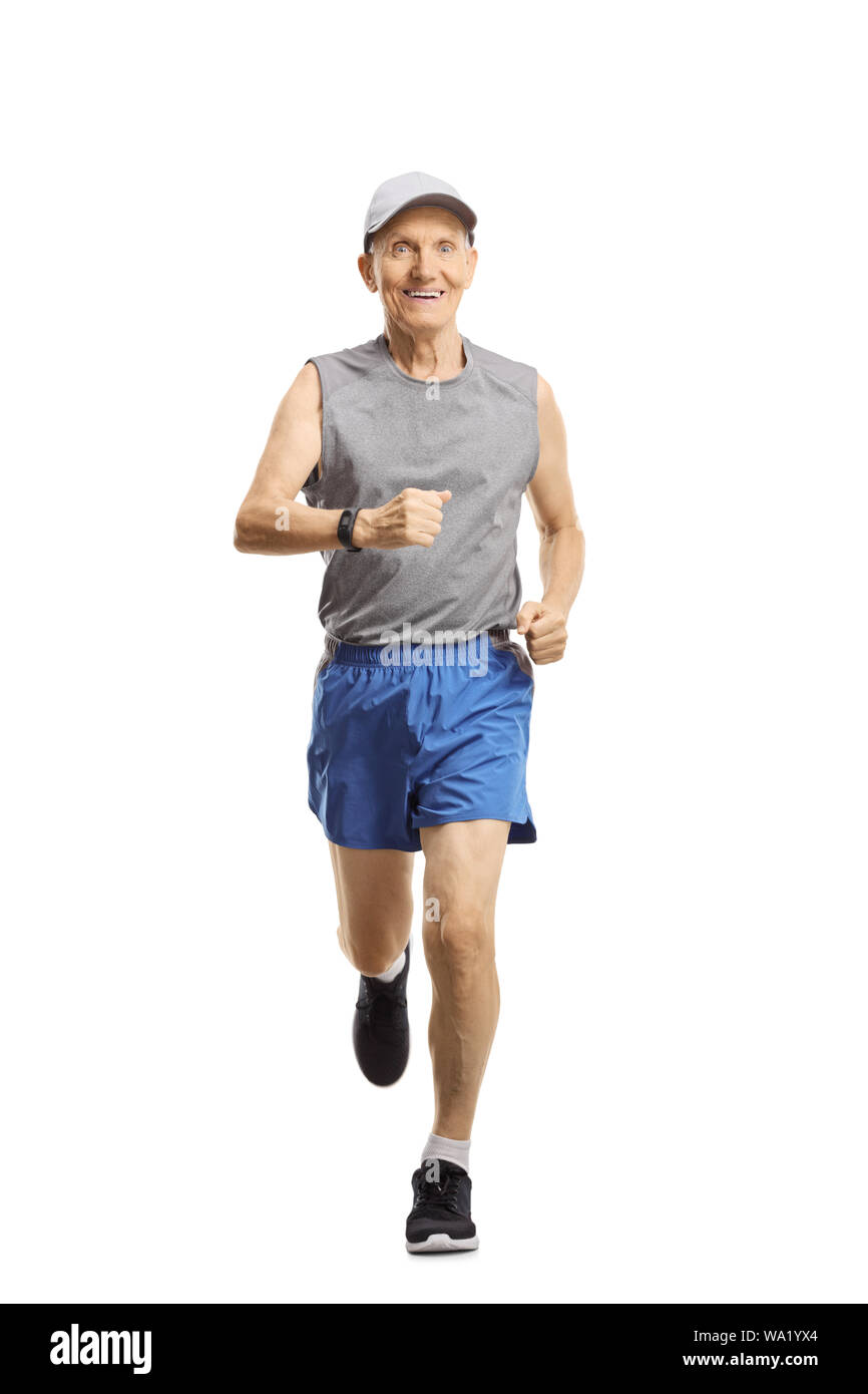 Full length portrait of a smiling senior man running and looking at the camera isolated on white background Stock Photo