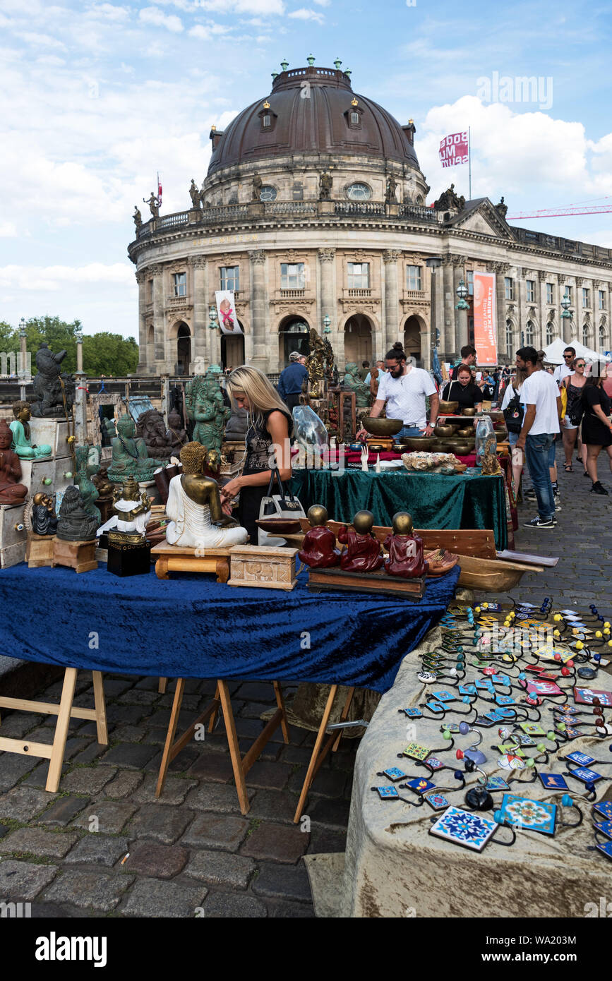 Shoppers at the Antique and Book Market with the Bode Museum in the background, Berlin, Germany. Stock Photo