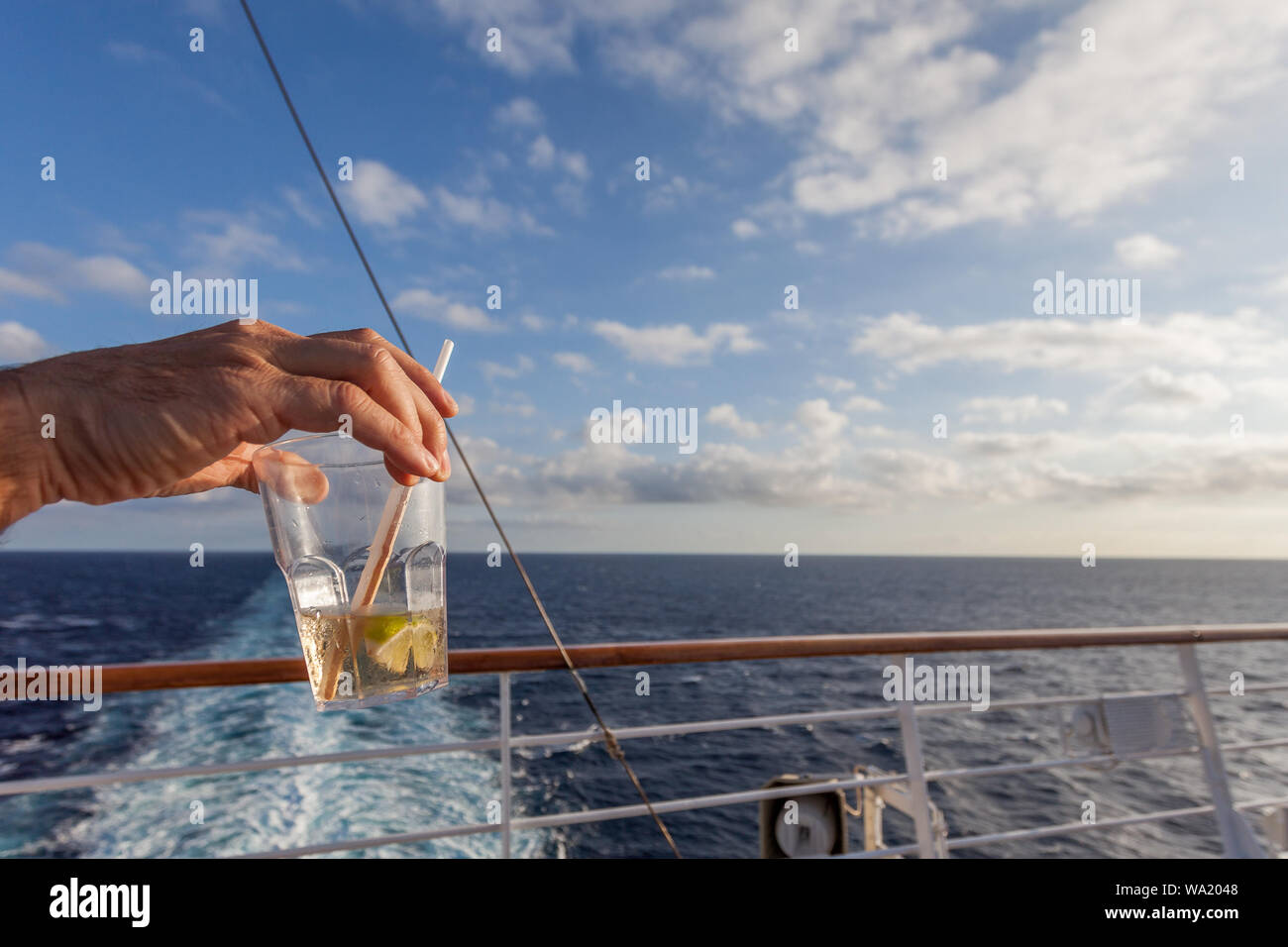 Glass of gin and tonic in a upper deck of cruise ship, Greece Stock Photo