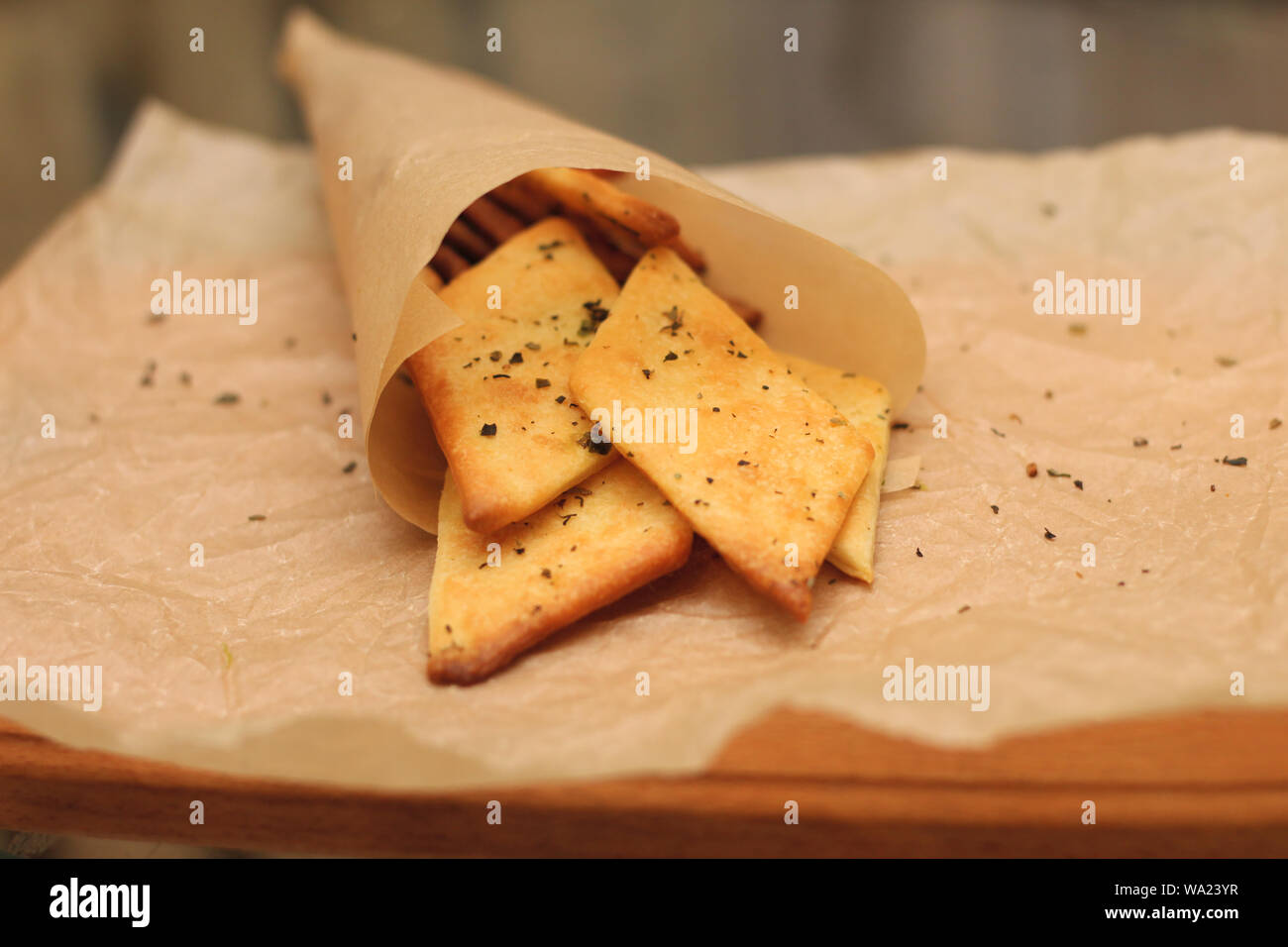 tasty crunchy diamond-shaped snack in a paper bag Stock Photo - Alamy