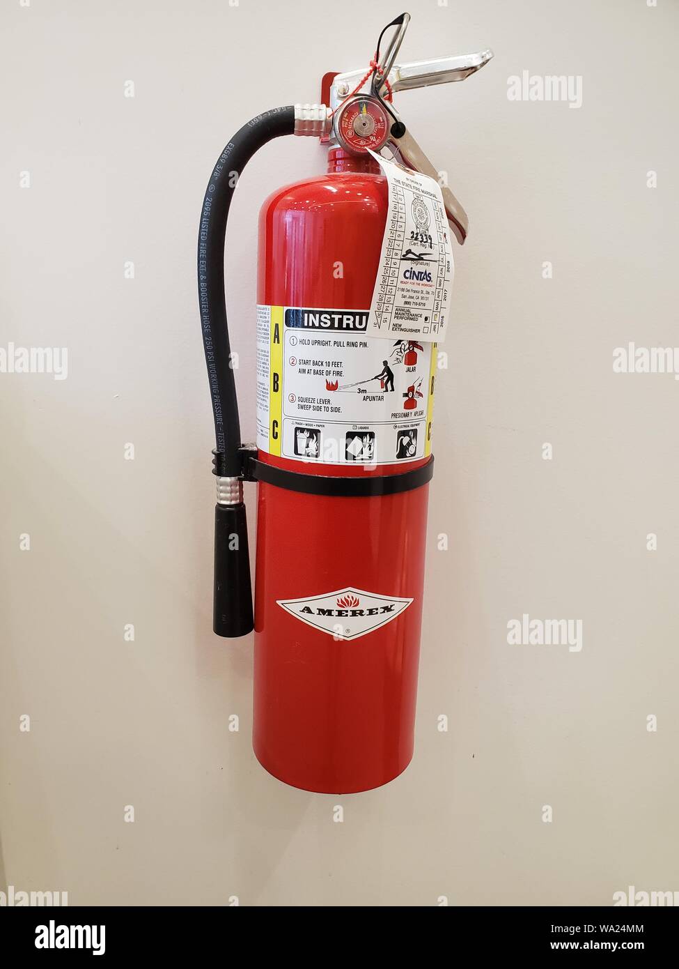 Close-up of Amerex fire extinguisher mounted on a wall in San Ramon, California, August 12, 2019. () Stock Photo