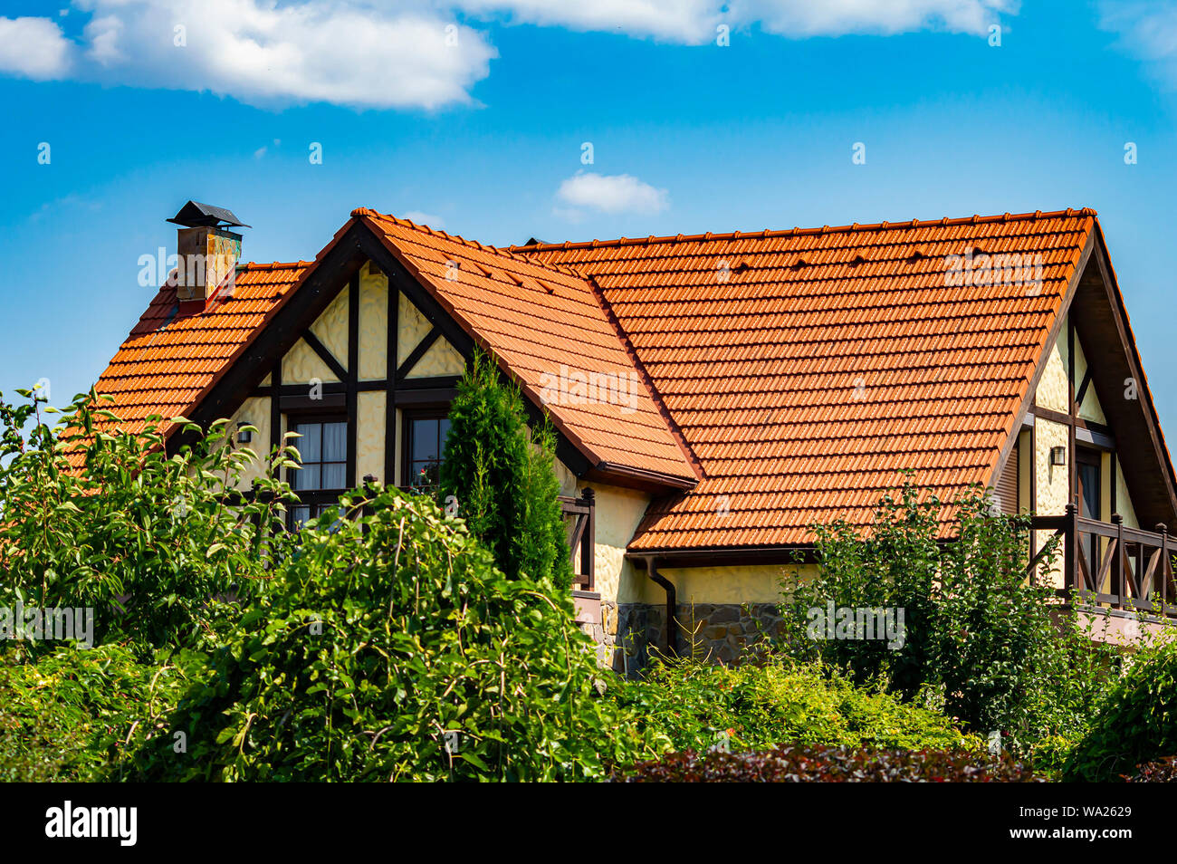 The roof of the house against the blue sky. Background Stock Photo - Alamy