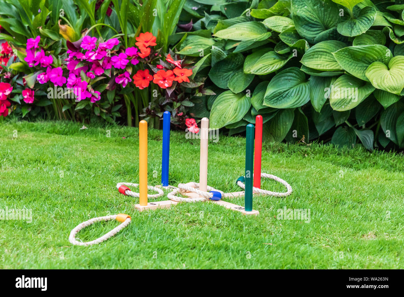 Ring toss game in a yard Stock Photo Alamy