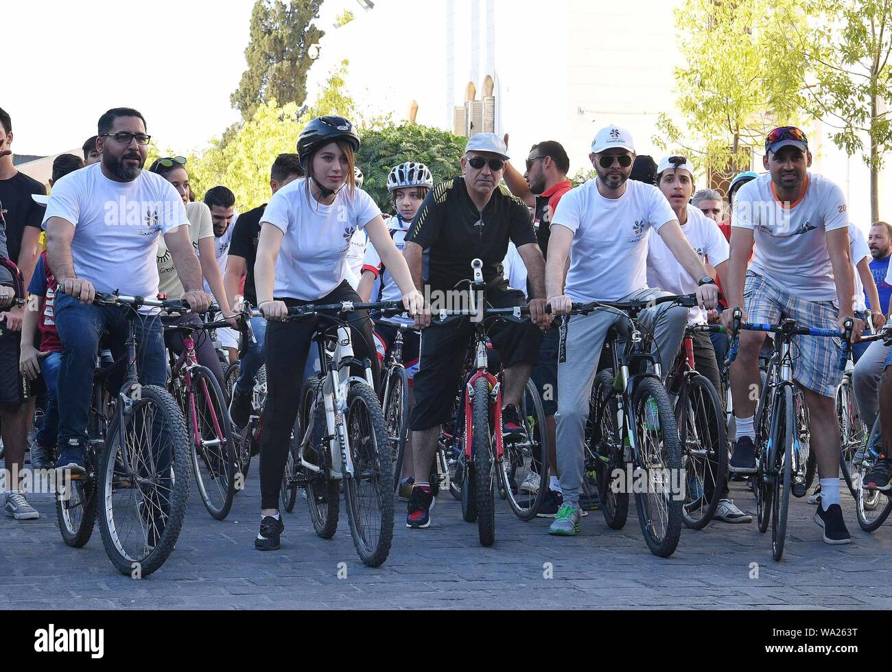 Damascus, Syria. 16th Aug, 2019. Syrians take part in a cycling event in Damascus, Syria, on Aug. 16, 2019. The event aims to raise awareness of protecting the environment. Credit: Ammar Safarjalani/Xinhua Stock Photo