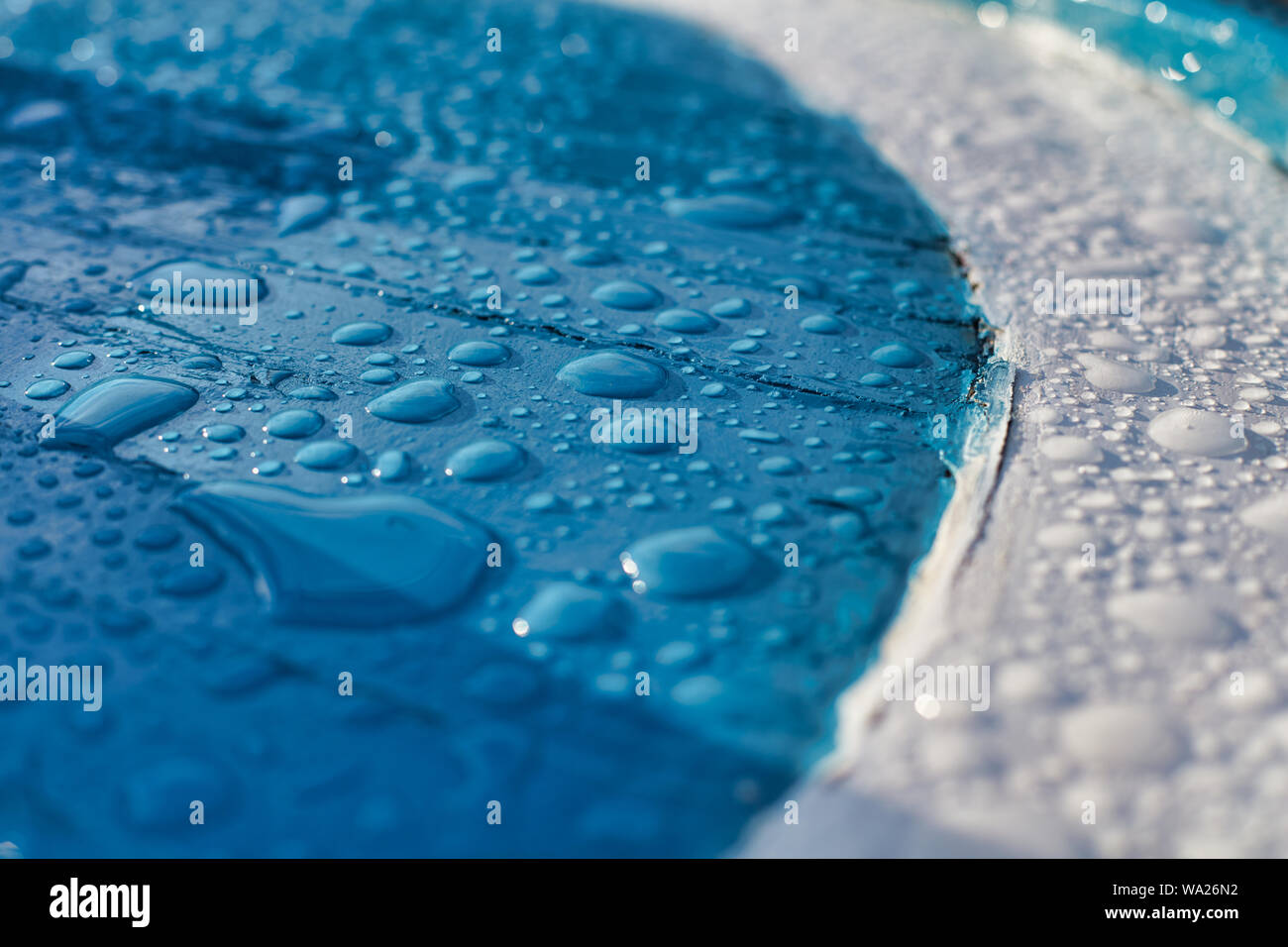 Water drops after rain on the surface of a fishing boat Stock Photo