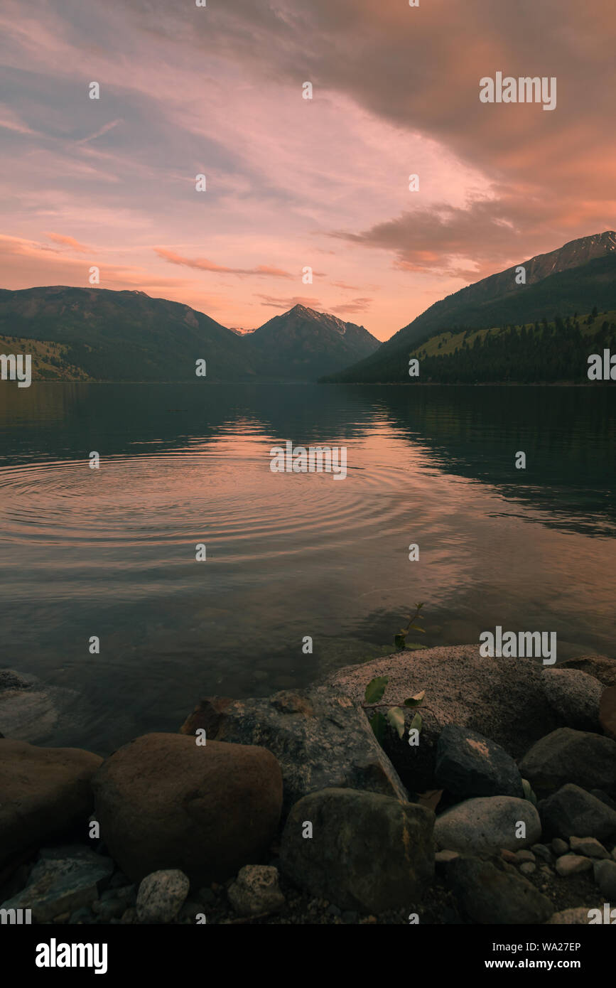 Rippling water lakeside at sunset under mountains, eastern Oregon, Pacific Northwest United States Stock Photo