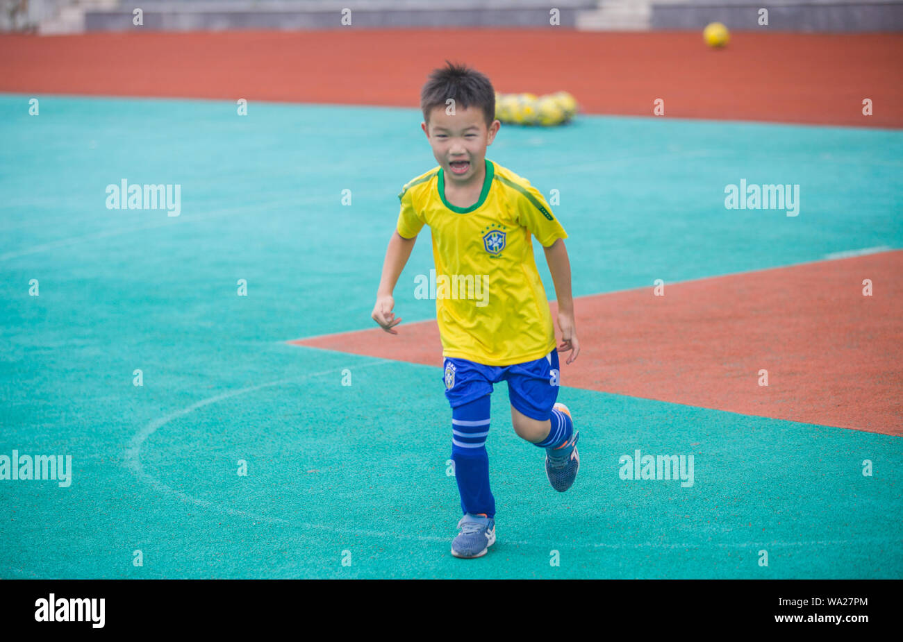 The boy playing football Stock Photo Alamy