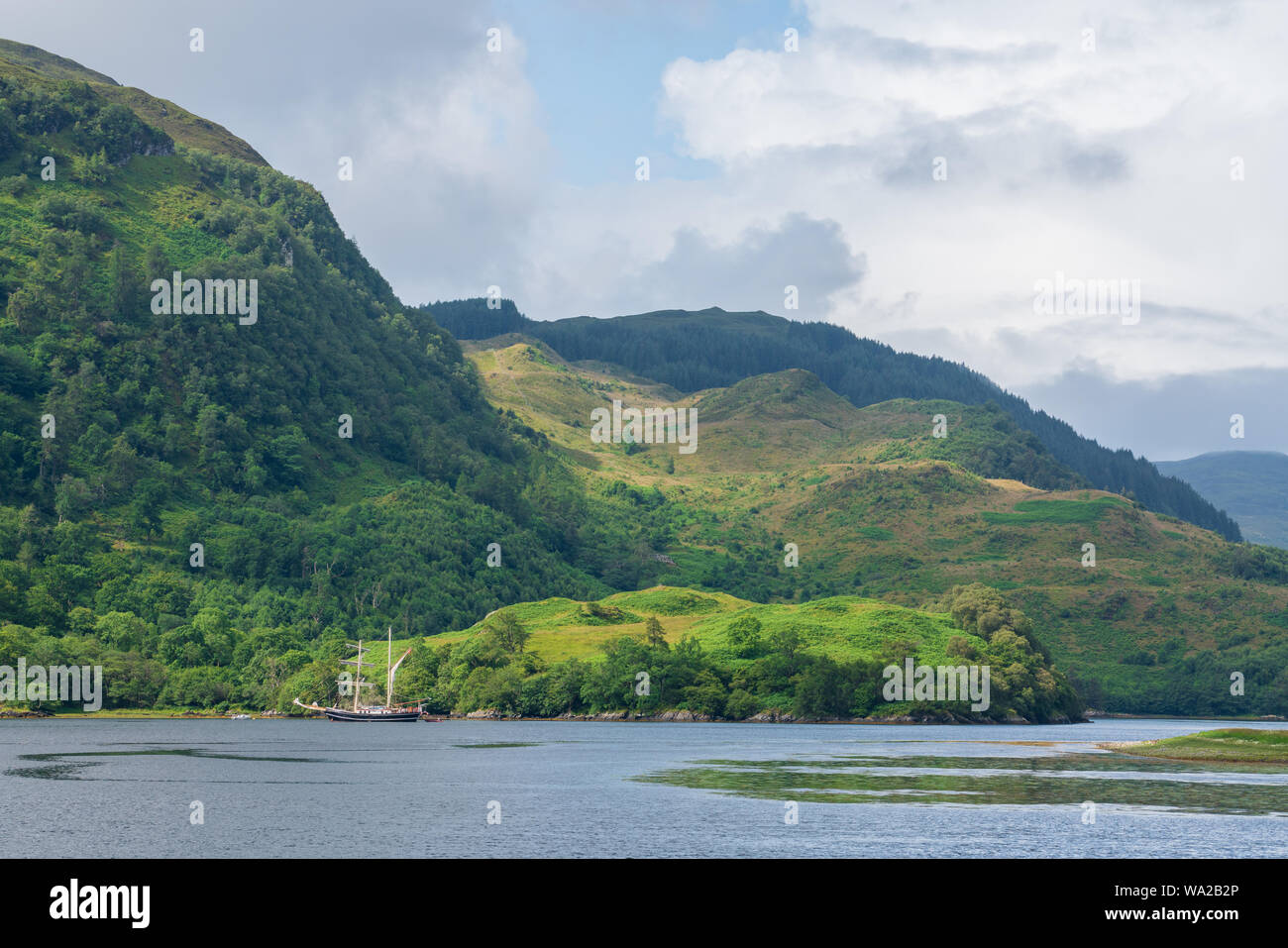 Eilean Donan Castle is one of the most recognised castles in Scotland and sits where three lochs meet, nestled amongst beautiful highland landscapes. Stock Photo