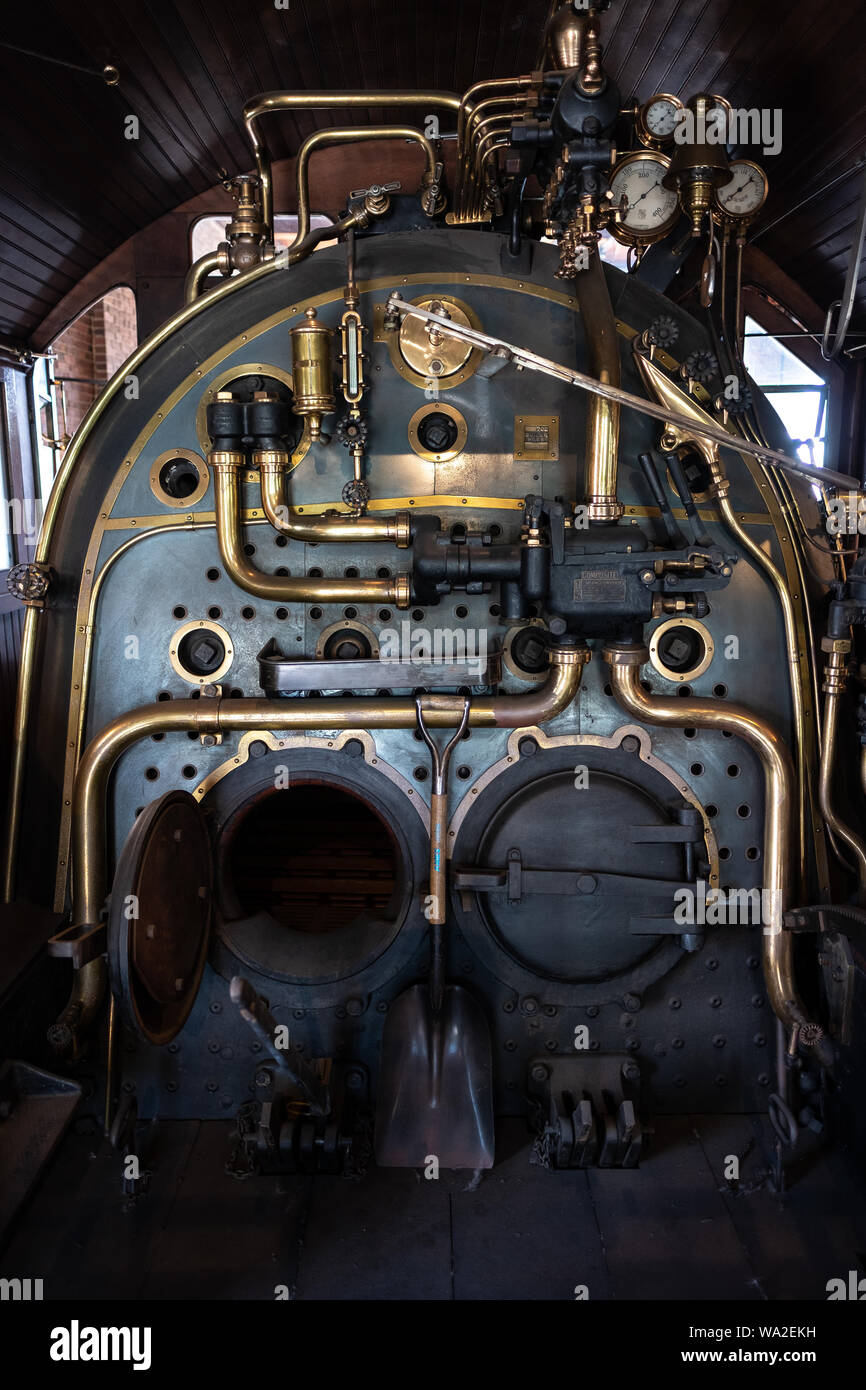 A vintage steam engine locomotive train on display at the roundhouse at Greenfield Village, Henry Ford Museum, Dearborn, Michigan, USA Stock Photo