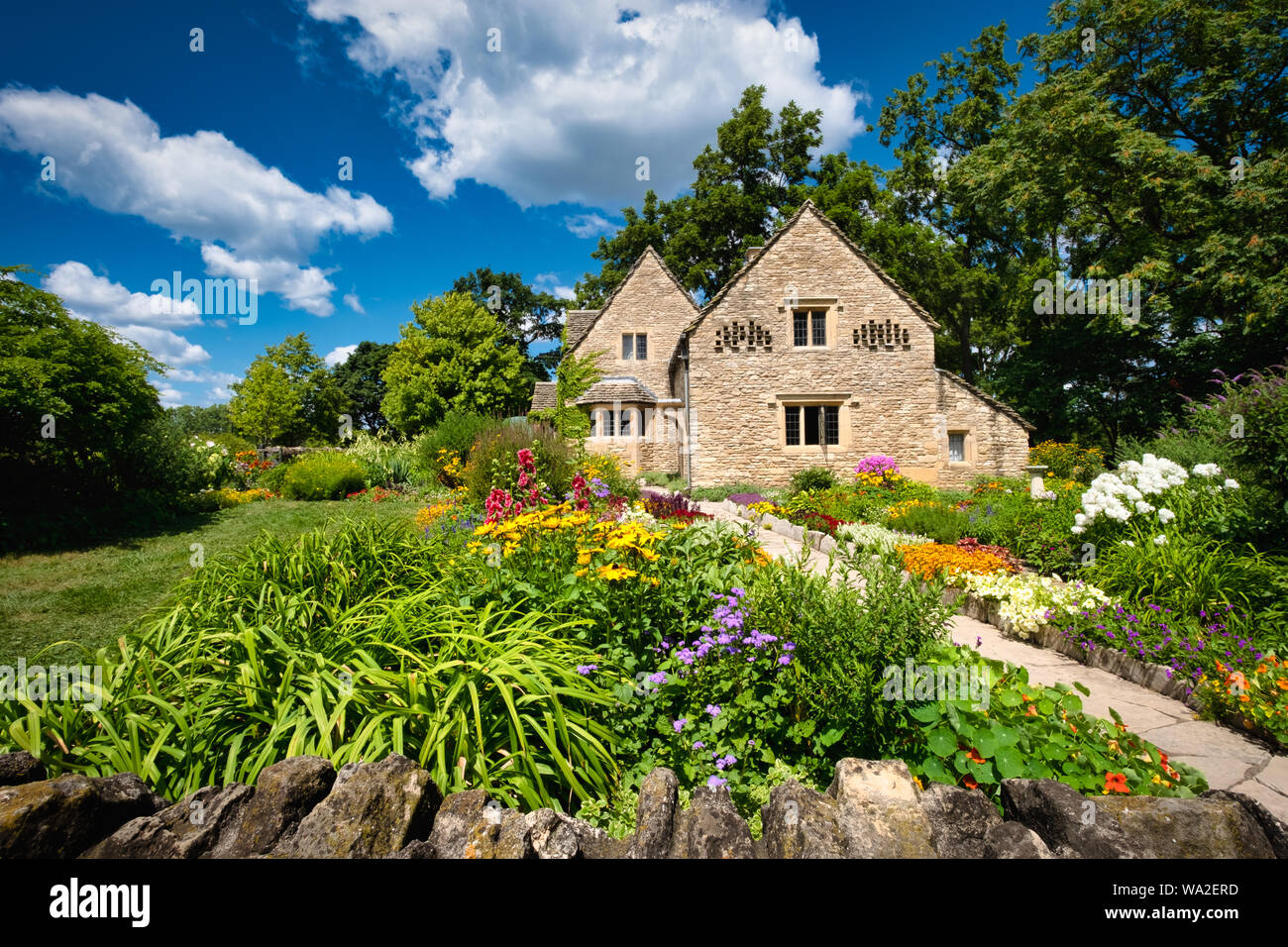 Cotswold Cottage And Its Surrounding English Gardens Located In
