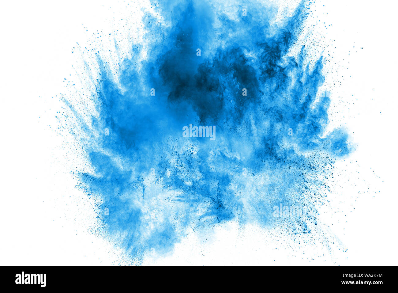 Bizarre forms of blue powder explode cloud on white background. Launched blue dust particles splashing. Stock Photo