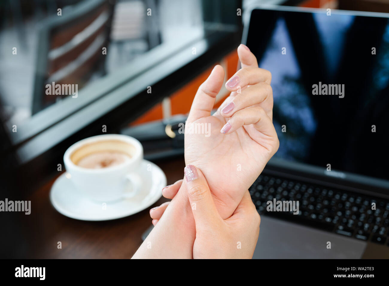 woman wrist hand arm pain long use mouse working. office syndrome