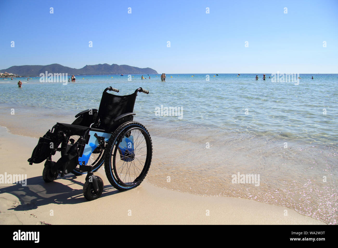 wheelchair on the beach Stock Photo Alamy