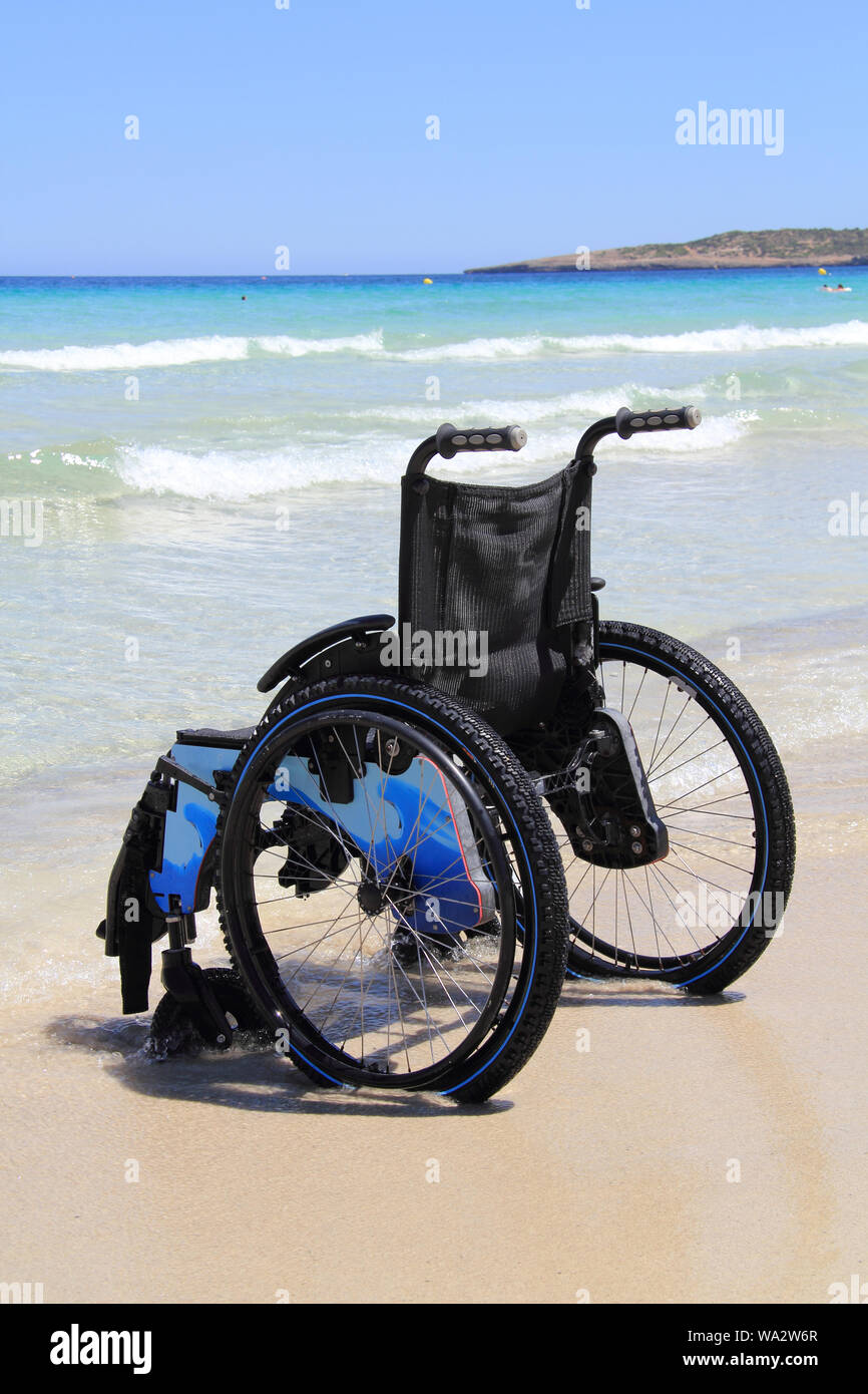 wheelchair on the beach Stock Photo Alamy