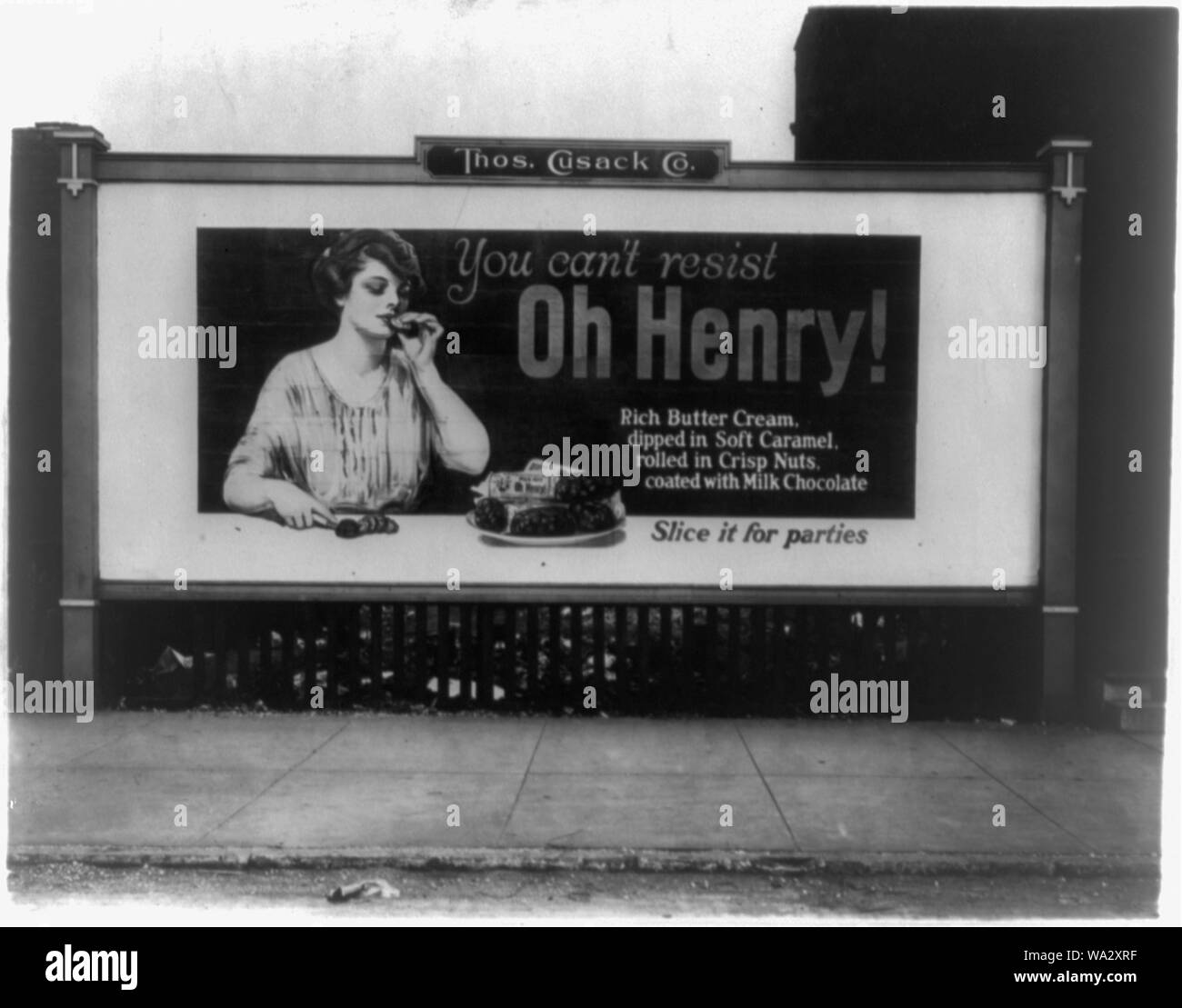 Billboard illustration showing a woman eating an Oh Henry candy bar Stock Photo