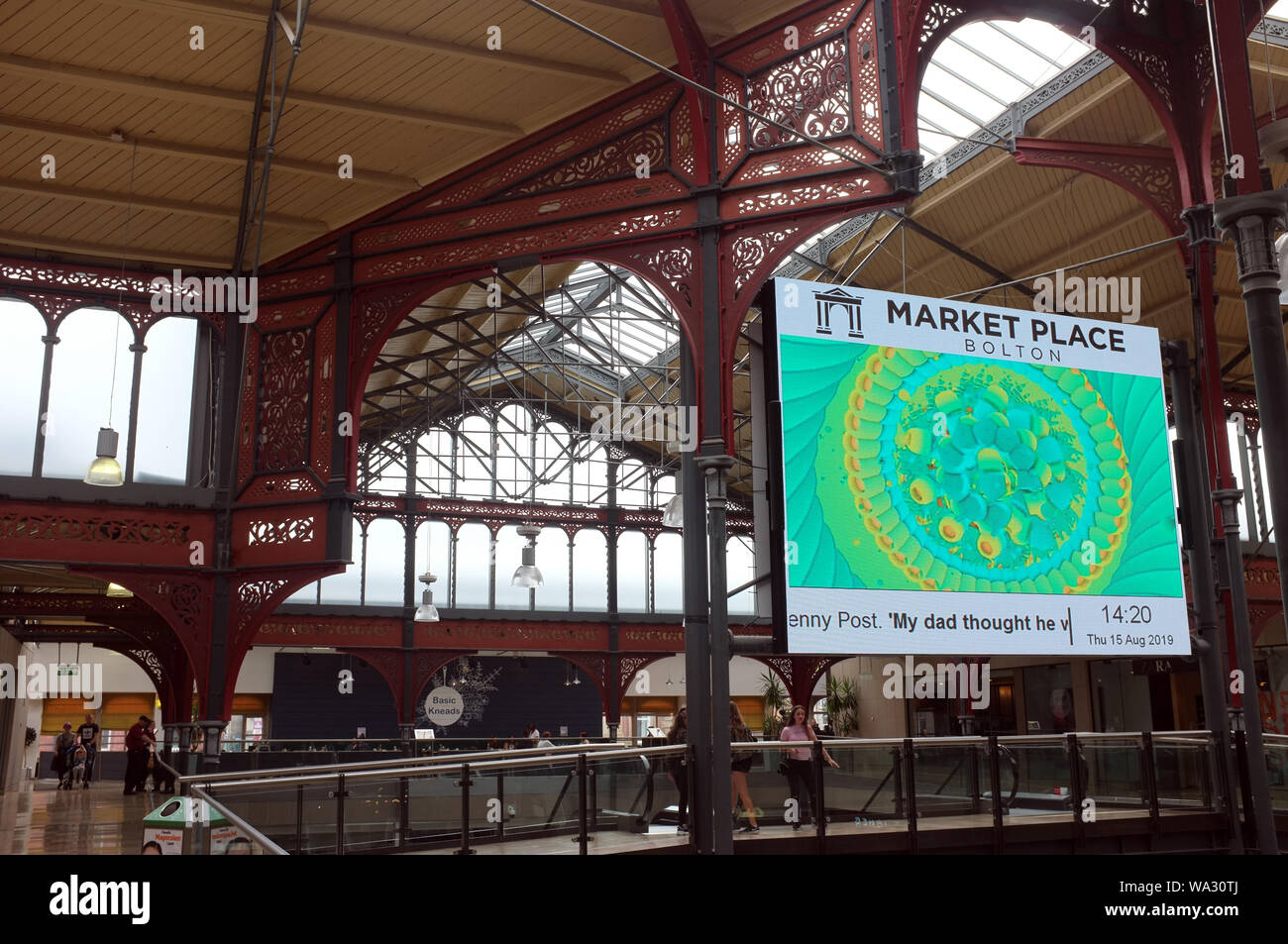 LCD advertising in Roof Bolton Market Place converted into a modern shopping mall while retaining the Victorian ironwork of the original Market Hall Stock Photo