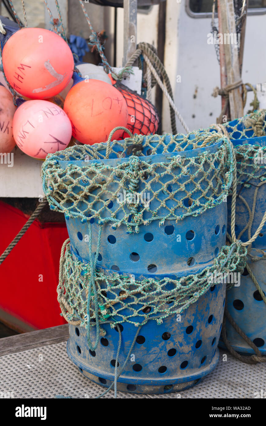 Fishing trawler, plastic fishing bins and nets Stock Photo Alamy