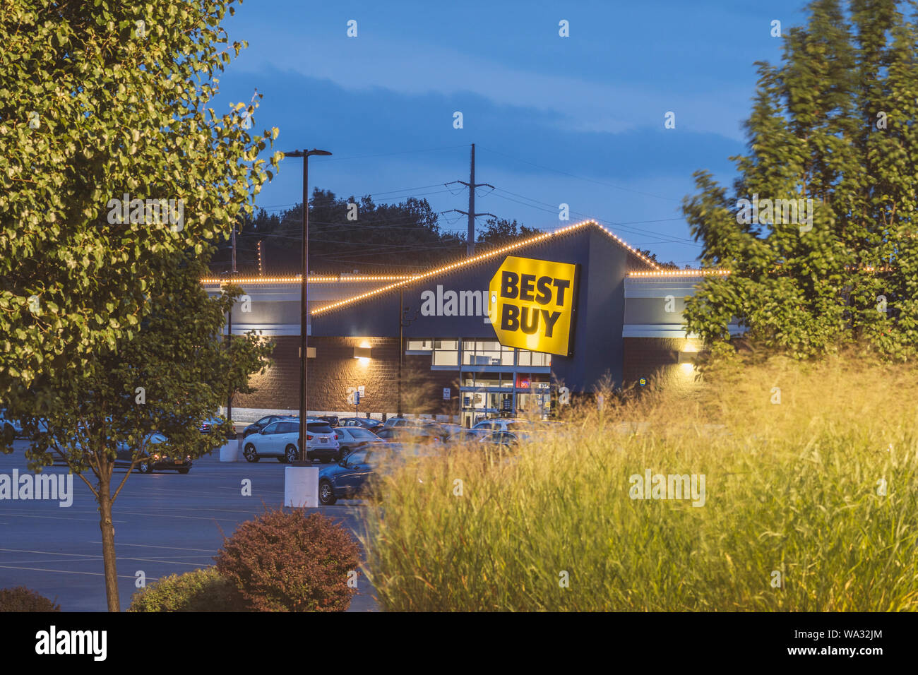 NEW HARTFORD, NEW YORK - AUG 16, 2019: Night view of Best Buy, is a major retail chain that sells all kinds of consumer electronics products. Stock Photo