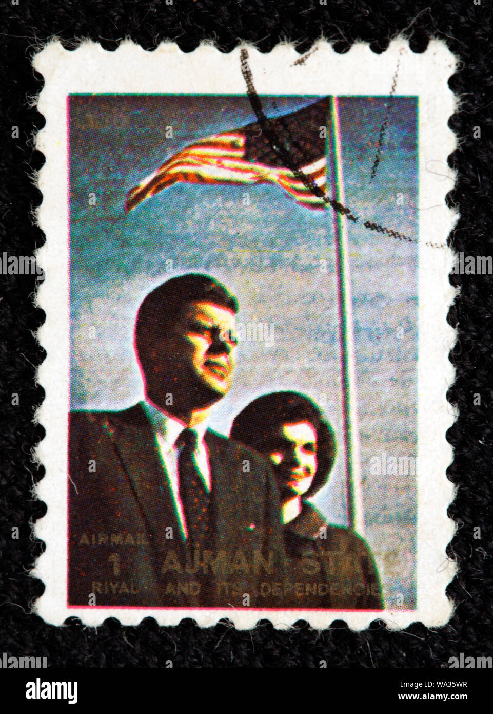 John F. Kennedy (1917-1963), JFK and his wife Jacqueline, postage stamp, Ajman, 1973 Stock Photo
