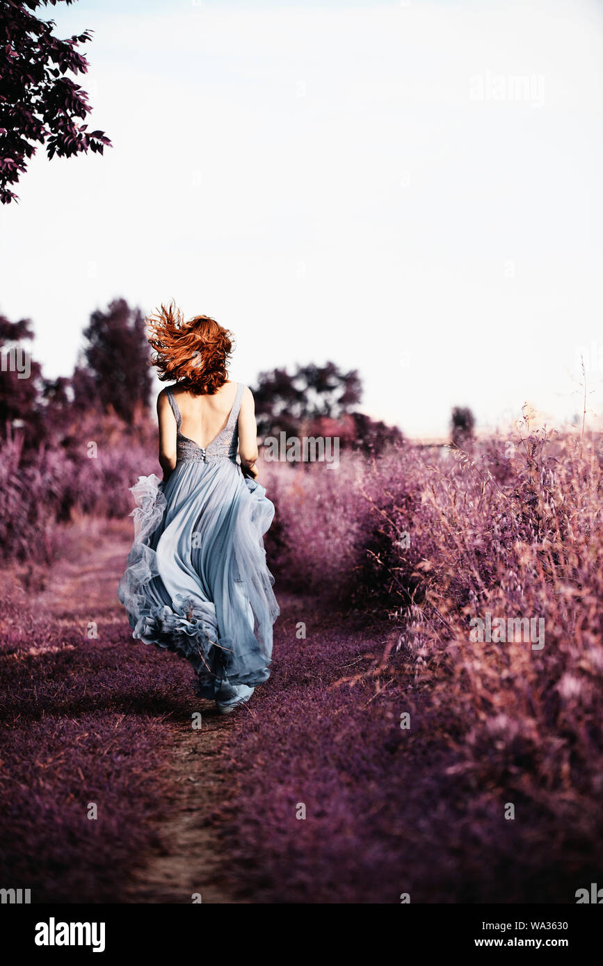 Woman running dress rear view hi-res stock photography and images - Alamy