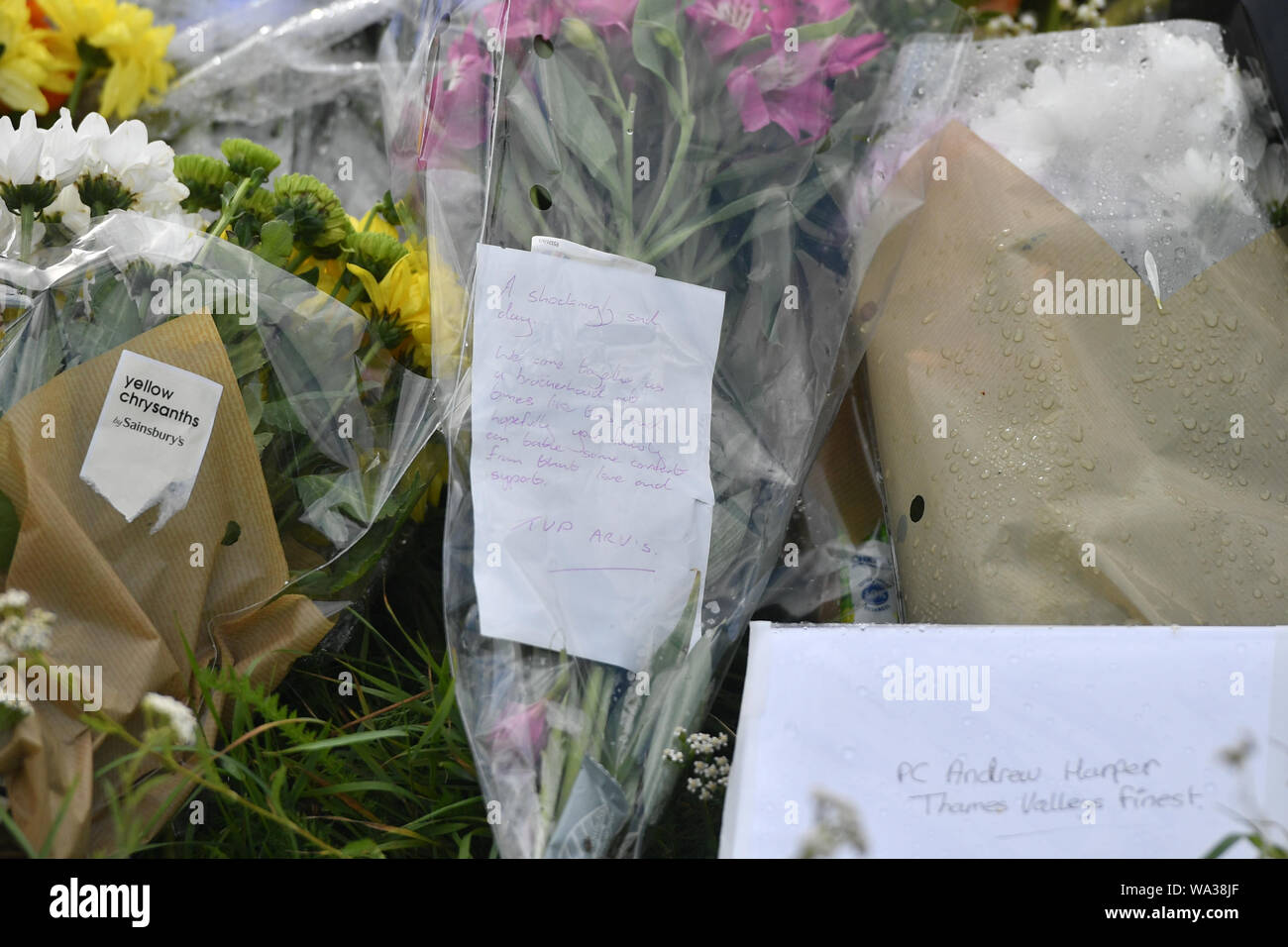 A messages on floral tributes at the scene, where Thames Valley Police officer Pc Andrew Harper, 28, died following a 'serious incident' at about 11.30pm on Thursday near the A4 Bath Road, between Reading and Newbury, at the village of Sulhamstead in Berkshire. Stock Photo