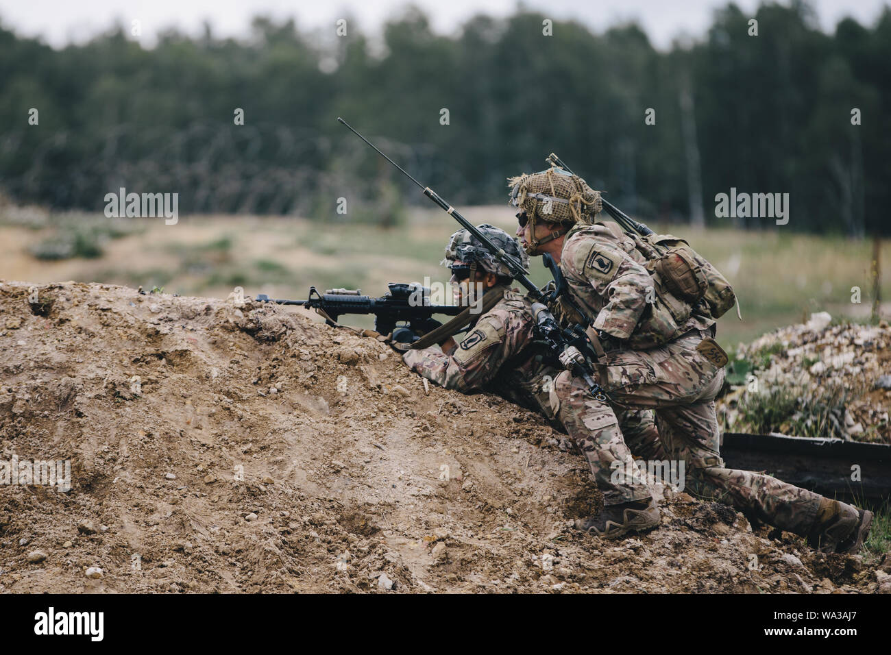 U.S. Army paratroopers assigned to 2nd Battalion, 503rd Infantry Regiment, 173rd Airborne Brigade fire weapon during Exercise Rock Shock 2 in Grafenwoehr Training Area, August 12-13, 2019.    The 173rd Airborne Brigade is the U.S. Army’s Contingency Response Force in Europe, providing rapidly deployable forces to Europe, Africa and Central Commands areas of responsibilities. Forward deployed across Italy and Germany, the brigade routinely trains alongside NATO allies and partners to build partnerships and strengthen the alliance. Stock Photo