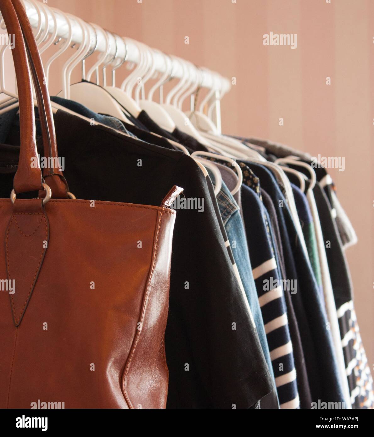 Coat hanger leather jacket hi-res stock photography and images - Alamy