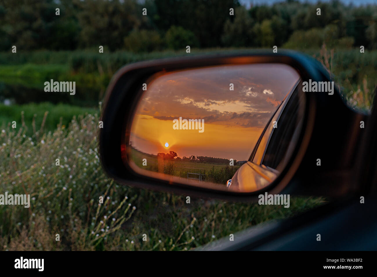 s outside rear view mirror showing a 