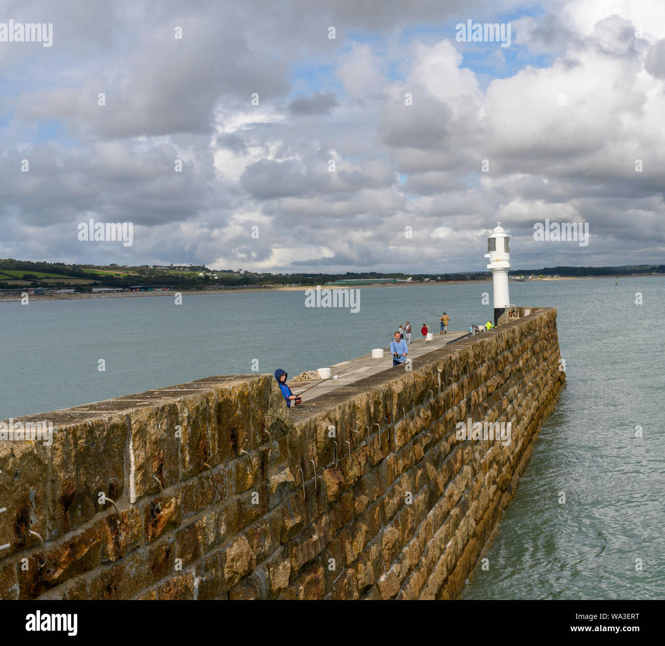 Landscape photograph showing Penzance harbour wall and Mount's Bay, Penzance, Cornwall, England, UK Stock Photo