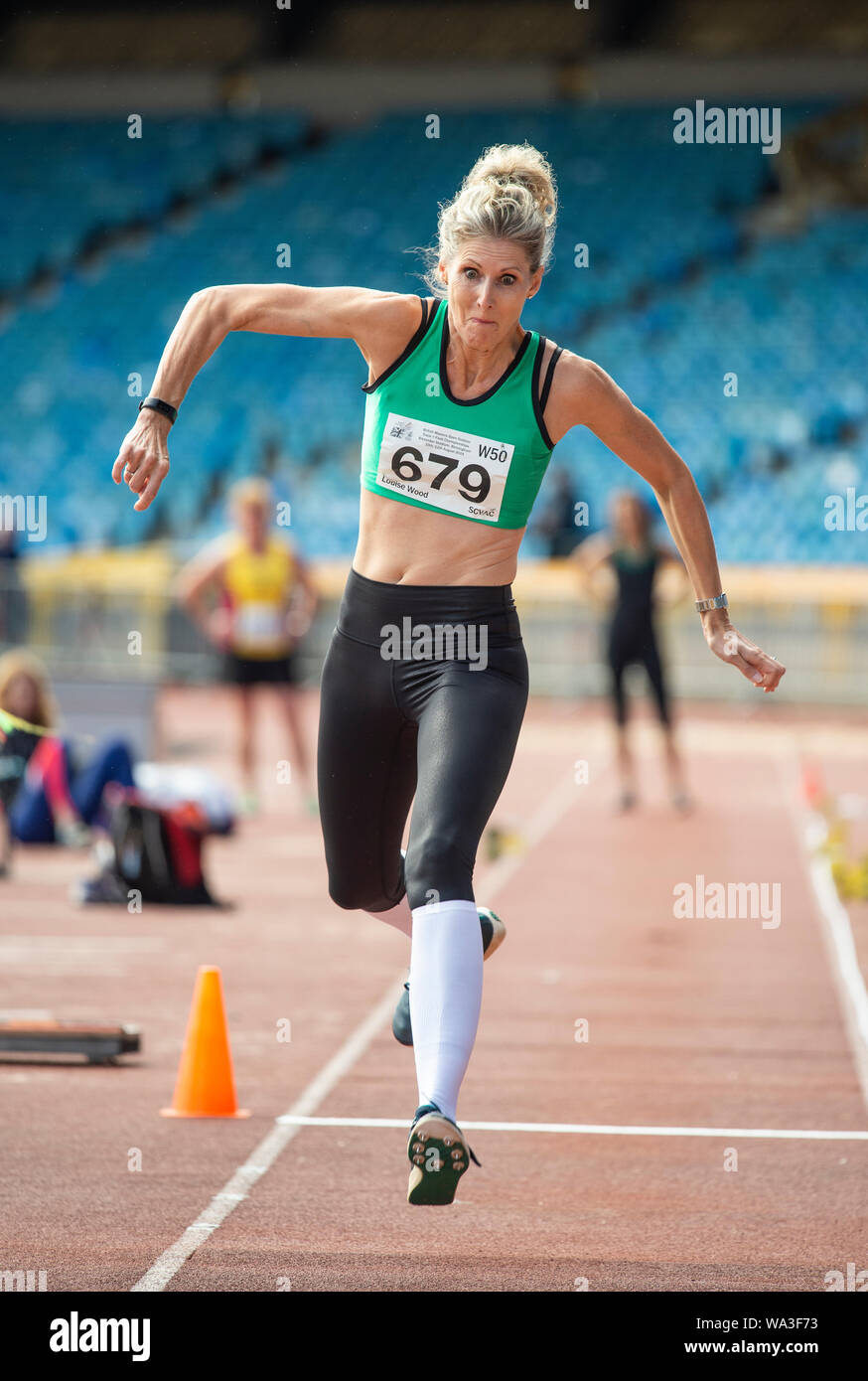 BIRMINGHAM - ENGLAND 10 AUG 2019: Louise Wood W50 competing in the Triple Jump on Day two of the British Master’s Championships, Alexander Stadium, Bi Stock Photo