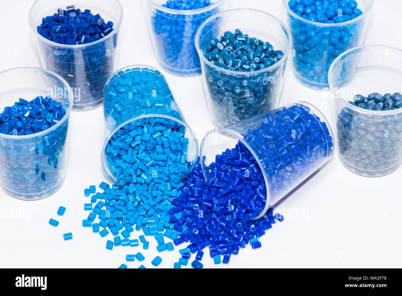 some blue dyed plastic polymer pellets in lab Stock Photo