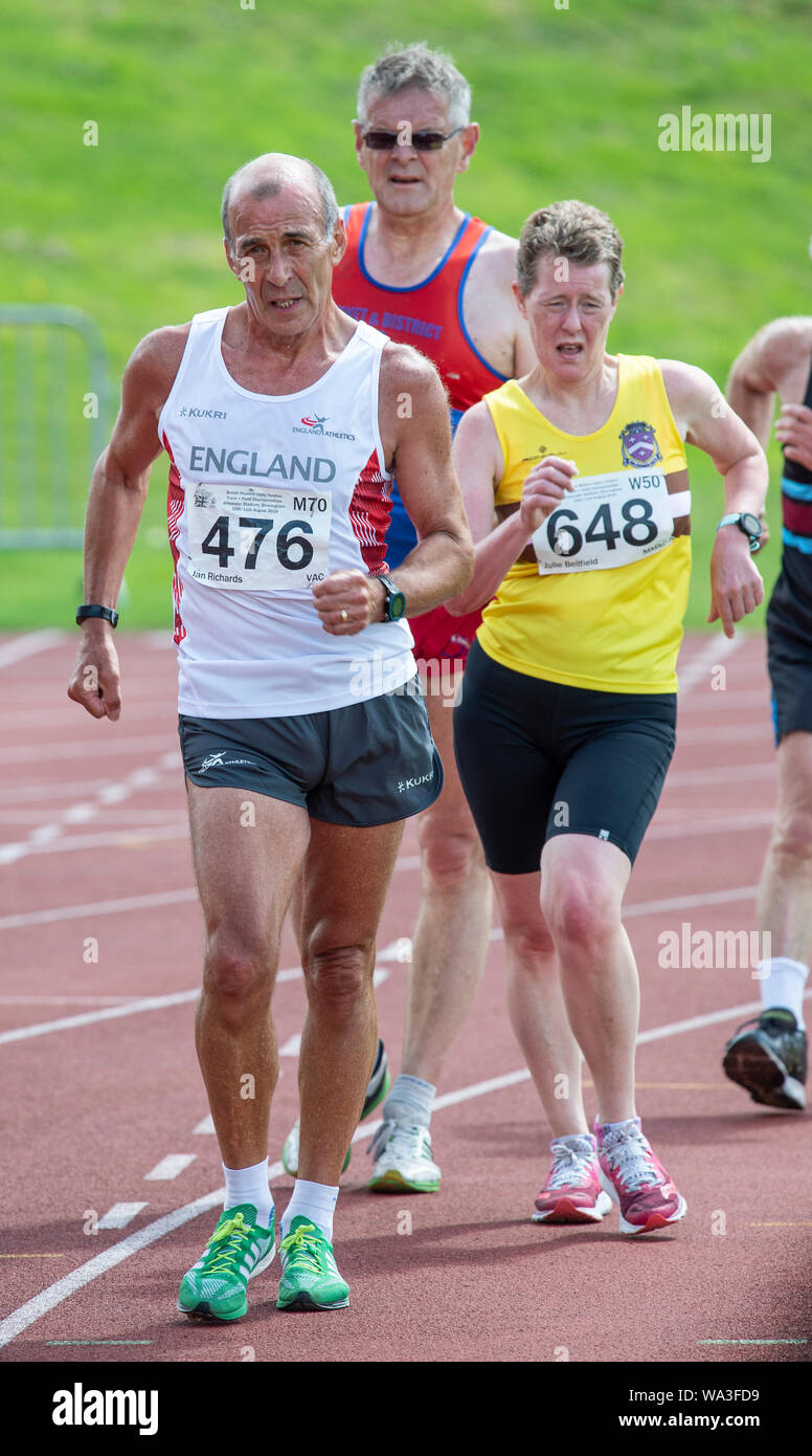 BIRMINGHAM - ENGLAND 10 AUG 2019:  Ian Richards M70 and Julie Bellfield W50 competing in the 5000m Walk on Day two of the British Master’s Championshi Stock Photo