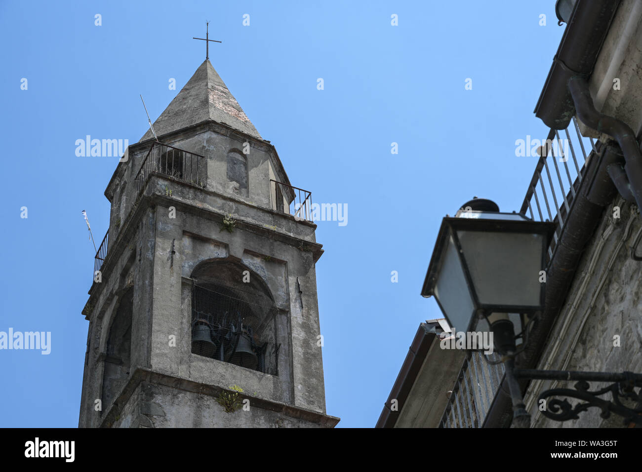 Bell tower from church of the Saints Gervasio and Portasio in Virgoletta, a beautiful ancient mountain village, district of Villafranca in Lunigiana, Stock Photo
