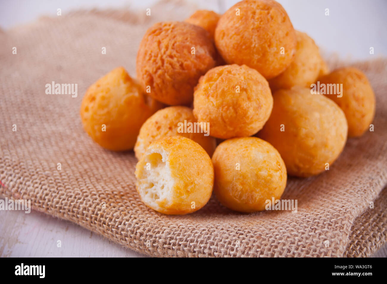 Small balls of freshly baked homemade cottage cheese doughnuts on the jute  napkin Stock Photo - Alamy