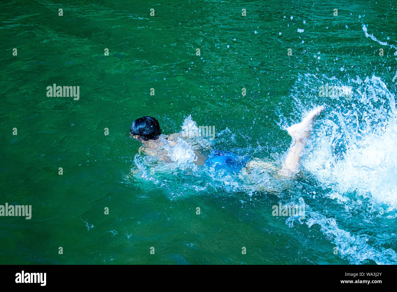 Young boy drowning in to the water, failure and rescue concept Stock Photo  - Alamy