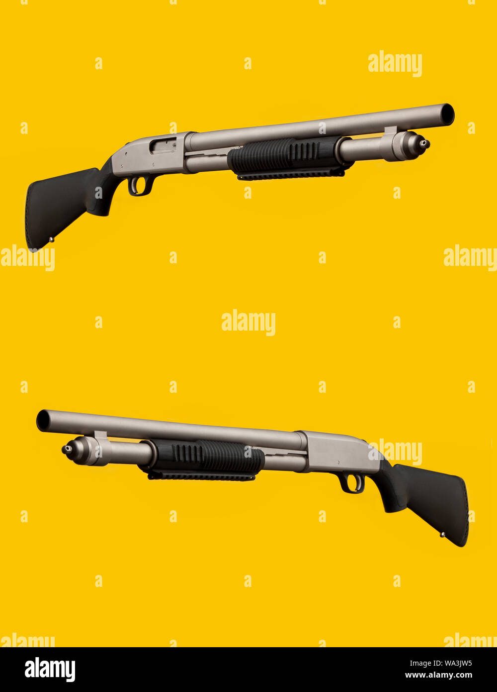 Silver-black shotgun on a yellow background. Stock Photo