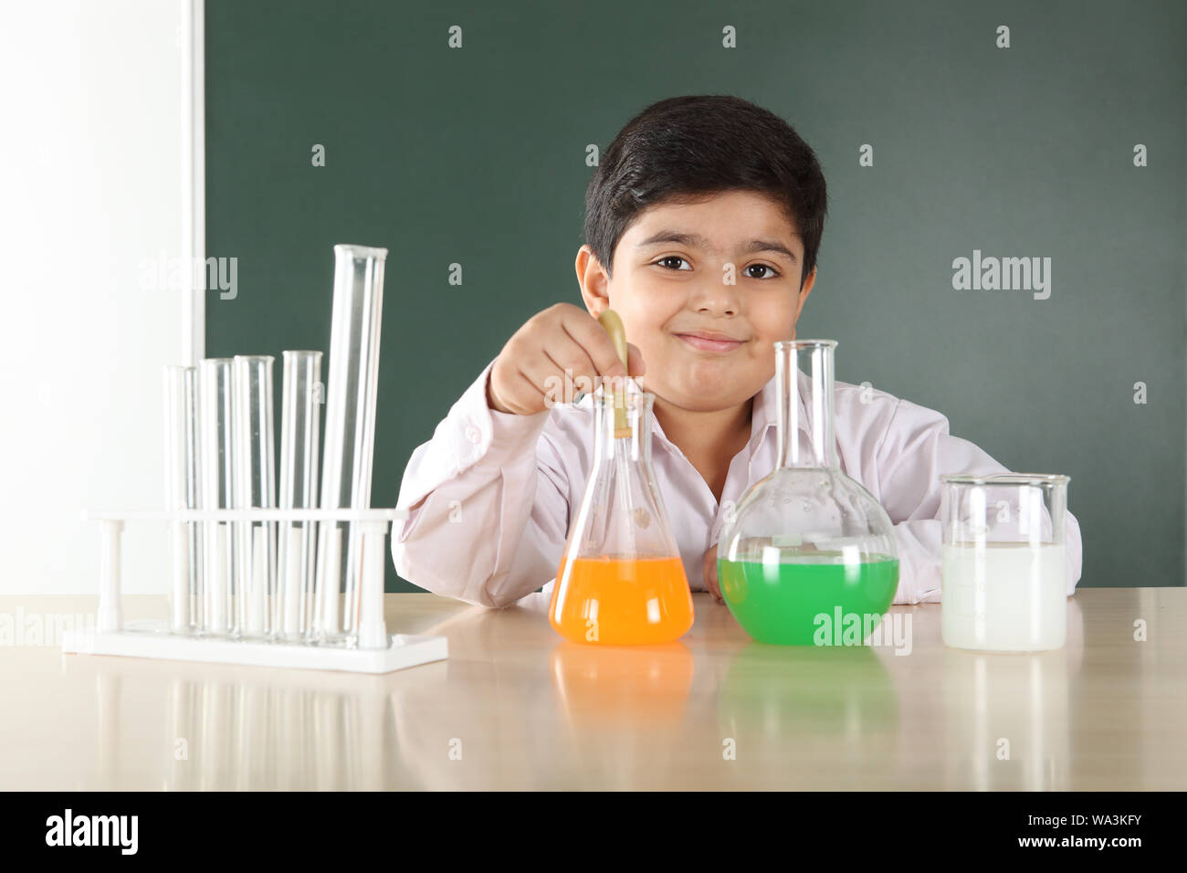 Schoolboy experimenting in a chemistry lab Stock Photo - Alamy
