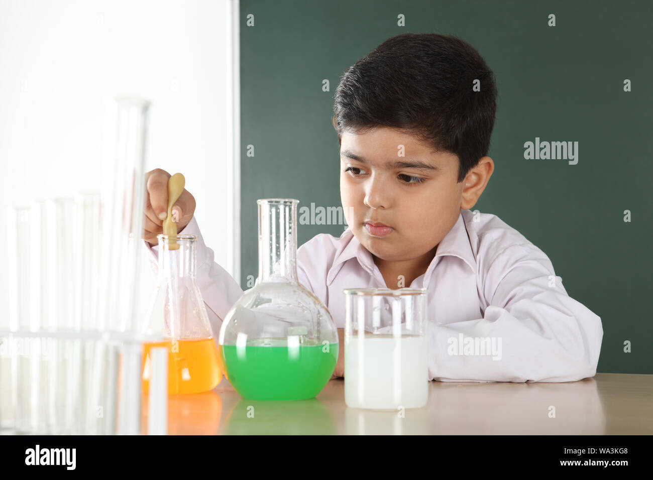 Schoolboy experimenting in a chemistry lab Stock Photo - Alamy